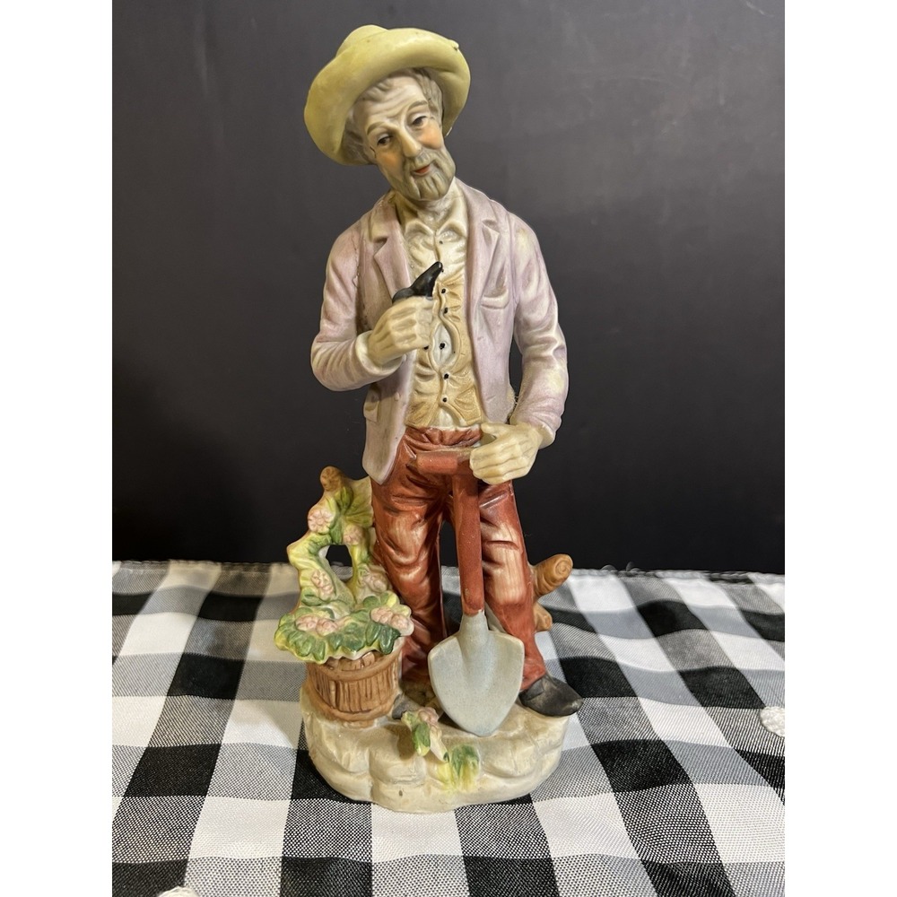 VTG UCGC MAN HOLDING PIPE WITH A SHOVEL"FARM LIFE" 8.5" T (2097)